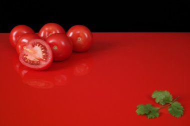 Fresh Red Roma Tomatoes On Red Table And Black Background, Copy Space