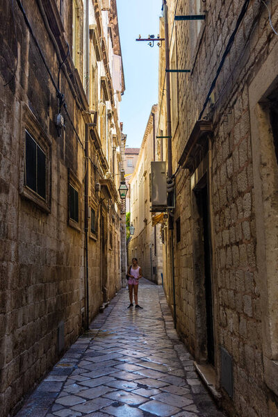 DUBROVNIK, CROATIA, AUGUST 13 2019: People walking in the ancient historic center