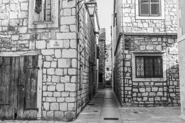 Black and white street view of the historic center of Stari Grad, Hvar, Croatia