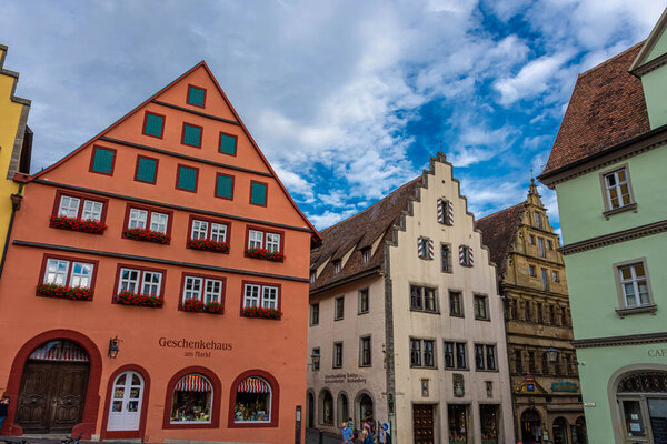 ROTHENBURG OB DER TAUBER, GERMANY, 26 JULY 2020: Colorful half-timbered houses in the street of the historic center