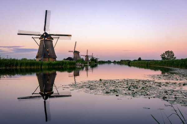 Amazing sunset over the windmills of Kinderdijk in the Netherlands