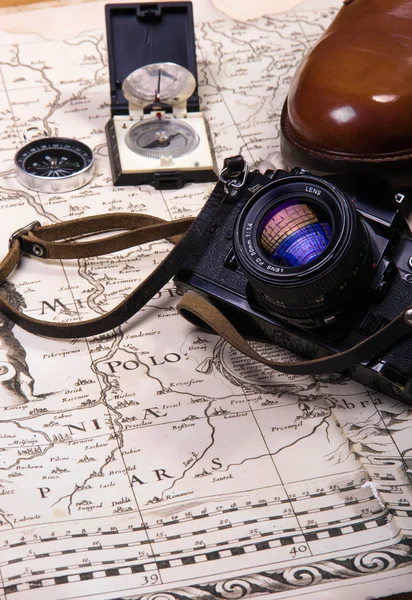 Travel boots old camera compas on old map with the roep — Stock Photo, Image