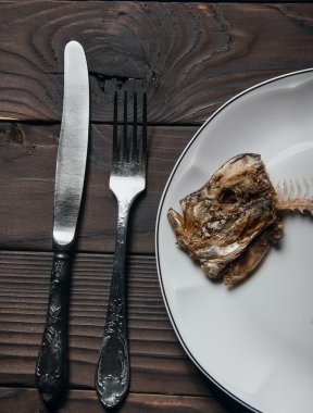 Head of fishbone knife and fork.Concept