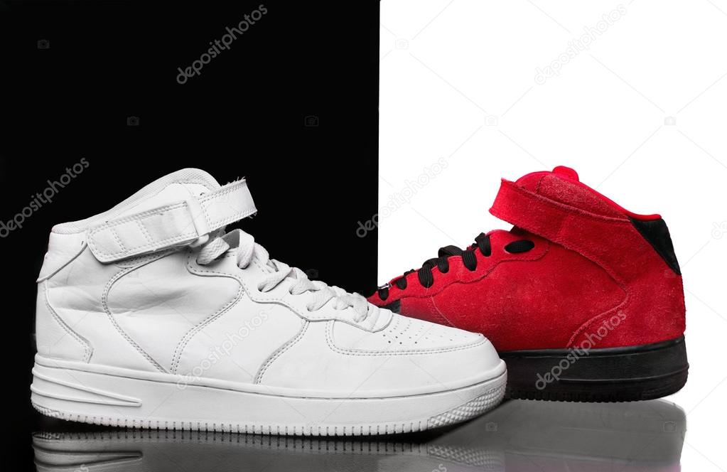 High sneakers white and red on glanc surface.Classic basketball Stock