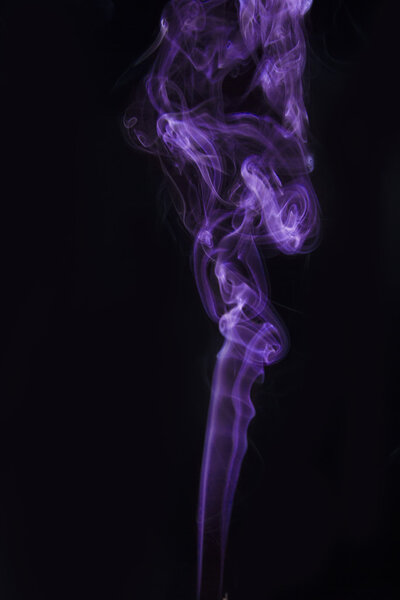 The abstract magenta figure of the smoke on a black background