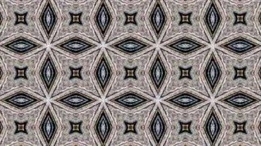 Bu video, simetrik desenli ve düzgün hareketli soyut kaleydoskop görsellerini büyülüyor. Sakinleştirici ve sürükleyici bir görsel deneyim yaratmak için tasarlanan bu dijital animasyonlar, tekrarlayan geometrik formları, uyumlu