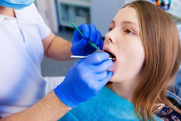 Dentist treats teeth Stock Image