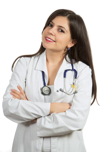 Portrait of young friendly beautiful female doctor with crossed arms and smiling — Stock fotografie