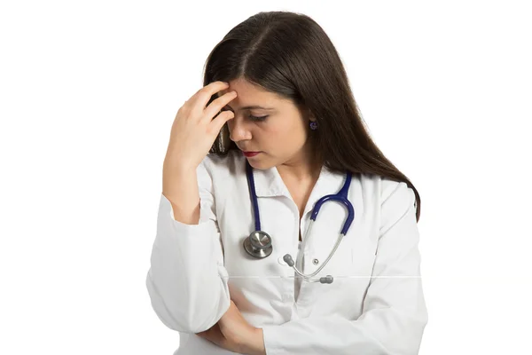 Portrait of young female doctor looking serious — Stock Photo, Image