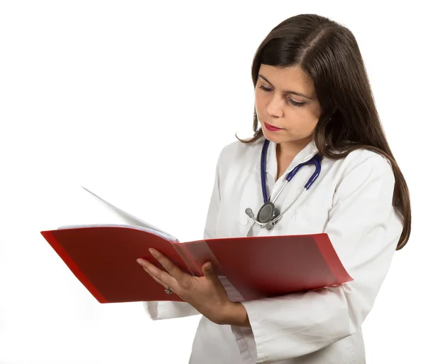 Portrait of young confident female doctor holding folder Stock Image