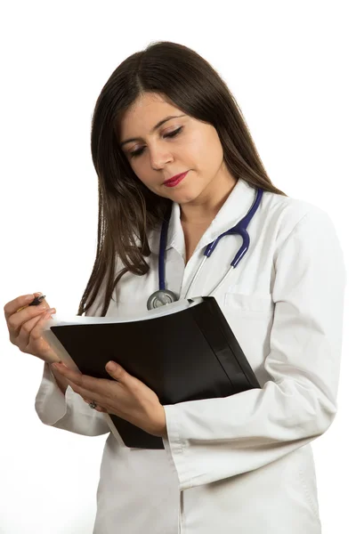 Portrait of young confident female doctor holding folder Stock Picture