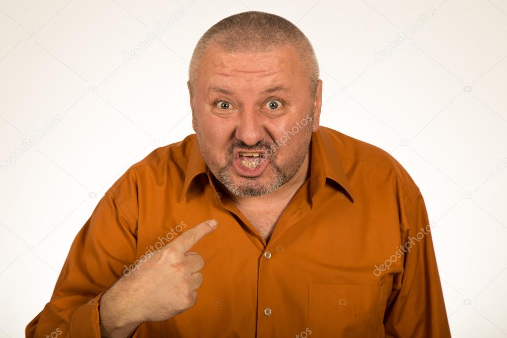Closeup portrait of angry, mad, unhappy man pointing at himself asking you mean me, you talking to me, isolated on white background