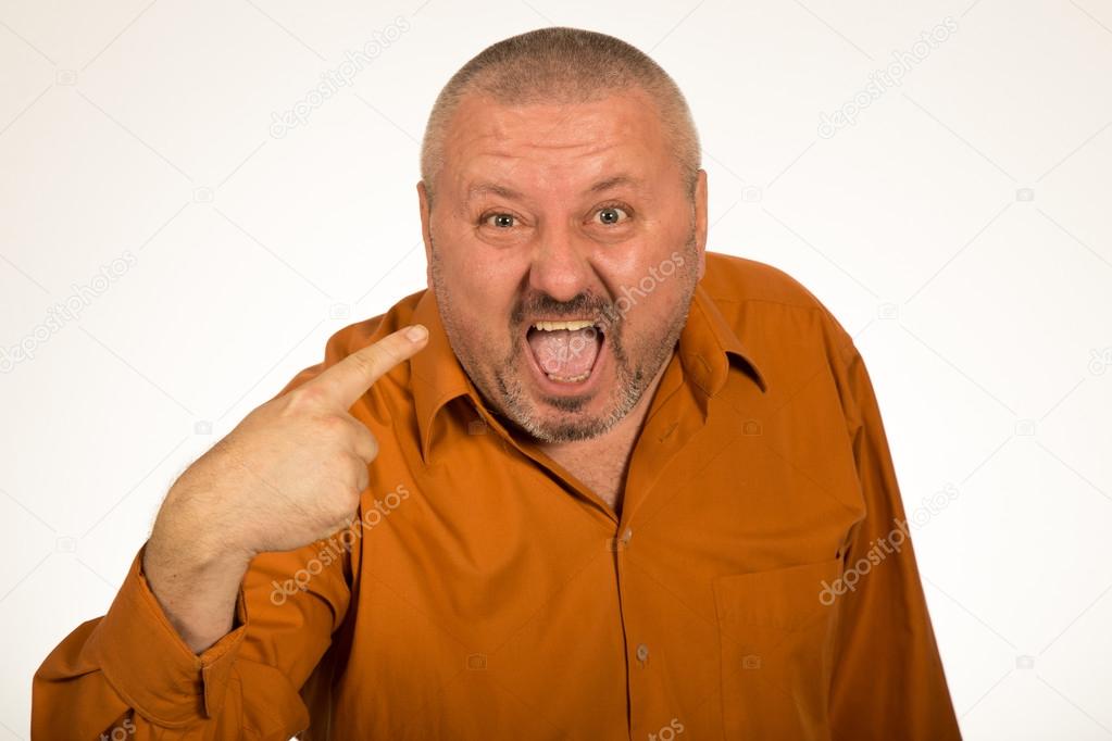 Closeup portrait of angry, mad, unhappy man pointing at himself asking you mean me, you talking to me, isolated on white background