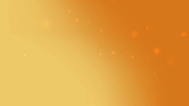 Altın turuncu, ışıltılı parçacık arka planında festival ve lüks tasarım için yumuşak, parlak bir gradyan var.