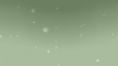 Yüzen Parıldayan Parçacıklar ve Sakin Ortam Işığıyla Yumuşak Yeşil Gradyan Arkaplanı