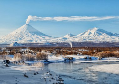 Russia,Kamchatka Peninsula. Village Klyuchi.The volcano of Klyuchevskaya sopka. (4800 m) is the highest active volcano of Eurasia. clipart