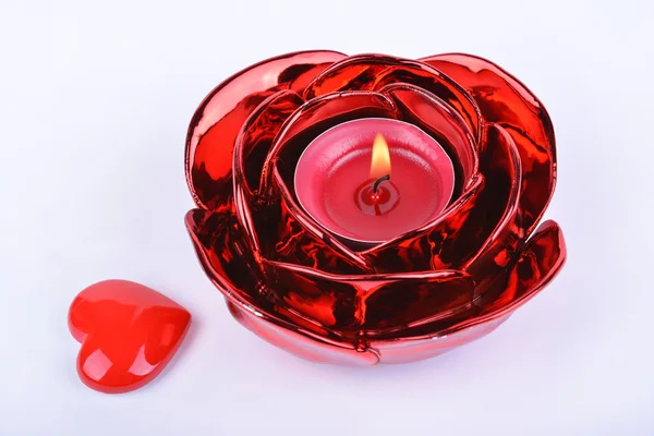 Red candle, candlestick and heart on white background — Stock Photo, Image