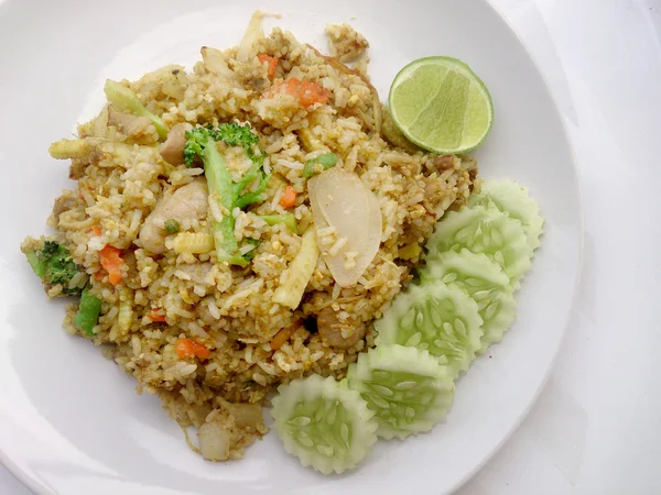 Close up green curry fried rice on dish, Delicious fried rice with chicken green curry, Thai Food
