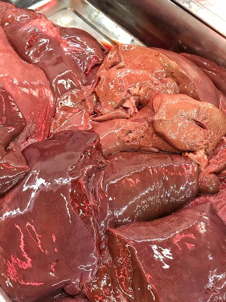 Chicken liver and heart.Background of chicken liver and heart.Liver and heart of broilers. Different kinds of Offal  on a Street Market