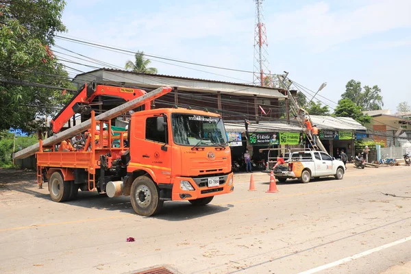 Lampang, Thailand, 21 May 2021 : The staff are cleaning the streets. A big tree fallen on the road in Luang Nuea Subdistrict,  Banmai Phahonyothin Banmai Road in front of Anubanngao (Panunuyom) School