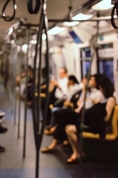 Blur Image of People traveling to work using the BTS (Bangkok Transit System) in the morning, Bangkok. Thailand Thai transportation system. vintage tone colour