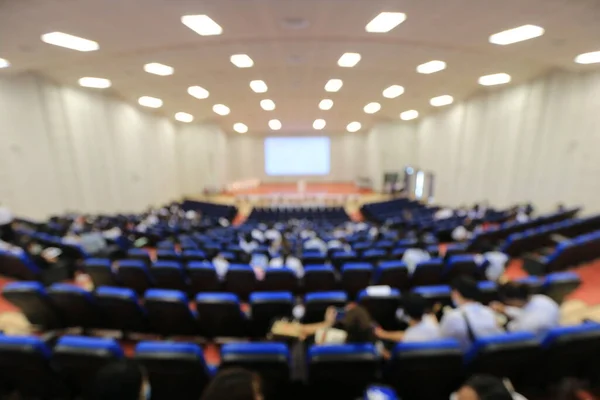 Blurred  of students, audience keynote speaker, people meeting start up business program collaboration discussion and listen in convention hall. event university or campus.