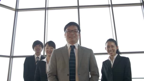 Japanese boss and his team celerate by jumping in the air slowmo HD — Stock Video