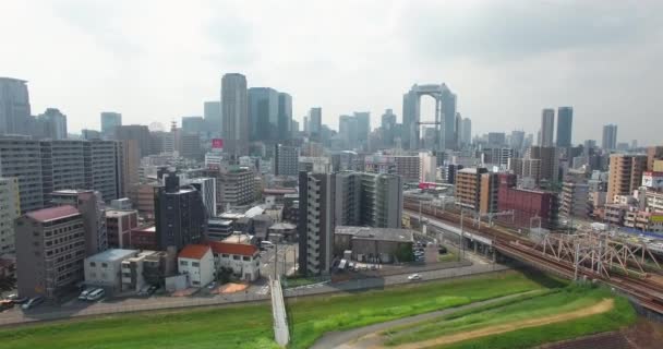 Acending aerial reveal shot of Osaka CIty Metropolitan area Japan 2nd largest city — Stock Video