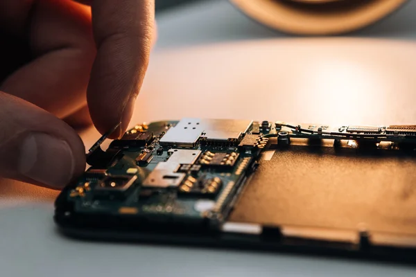 Disassembled parts on a smartphone — Stock Photo, Image