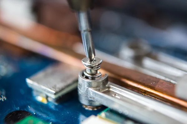 Small screwdriver and screw — Stock Photo, Image