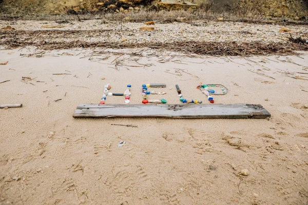 Help iscription on sand — Stock Photo, Image