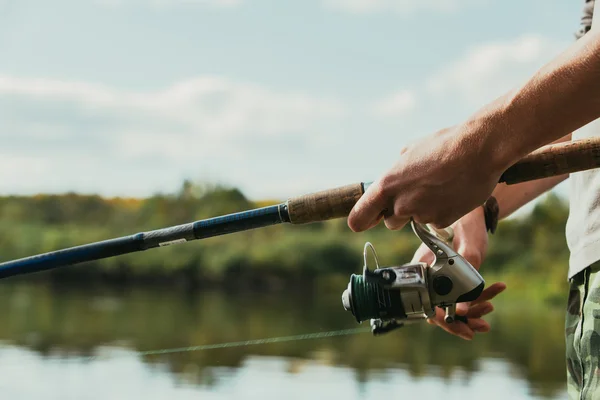 Man holding fishing pole