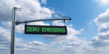 Road information board with text ZERO EMISSIONS on a background of blue sky. Clean mobility concept clipart