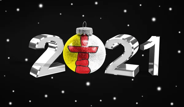 Happy new Year 2021, flag of Nunavut on a christmas toy, decorations isolated on dark background. Creative christmas concept.