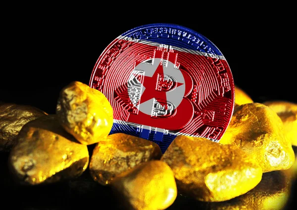 Bitcoin is marked with the flag of North Korea, against the background of gold ore