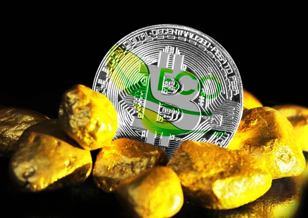 Bitcoin is marked with the flag of Ecology logo, against the background of gold ore
