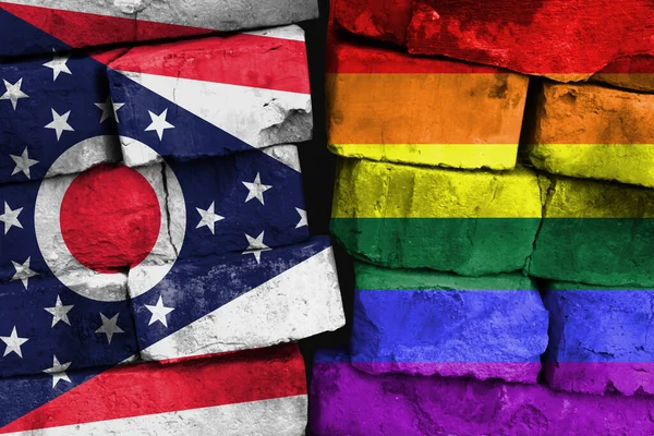 LGBT and State of Ohio flag on brick wall