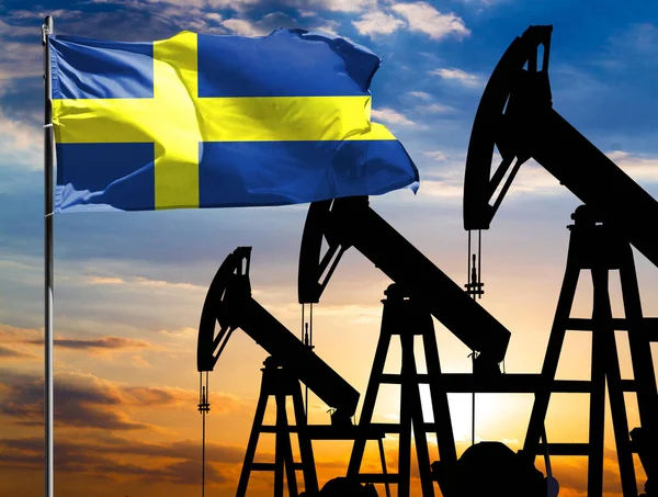 Oil rigs against the backdrop of the colorful sky and a flagpole with the flag of Sweden. The concept of oil production, minerals, development of new deposits.