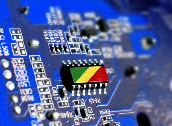 Electronic board with embedded microchip and shown flag of Congo,Republic. The concept of modern computer technologies.