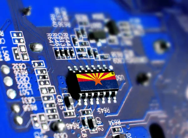 Electronic board with embedded microchip and shown flag State of Arizona. The concept of modern computer technologies.