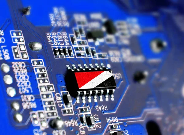 Electronic board with embedded microchip and shown flag of Sealand,Principality of. The concept of modern computer technologies.