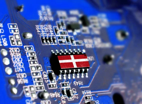 Electronic board with embedded microchip and shown flag of Sovereign Military Order of Malta. The concept of modern computer technologies.