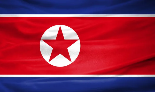 Realistic flag of North Korea on the wavy surface of fabric