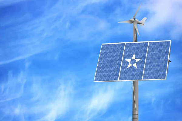 Solar panels against a blue sky with a picture of the flag of Somalia