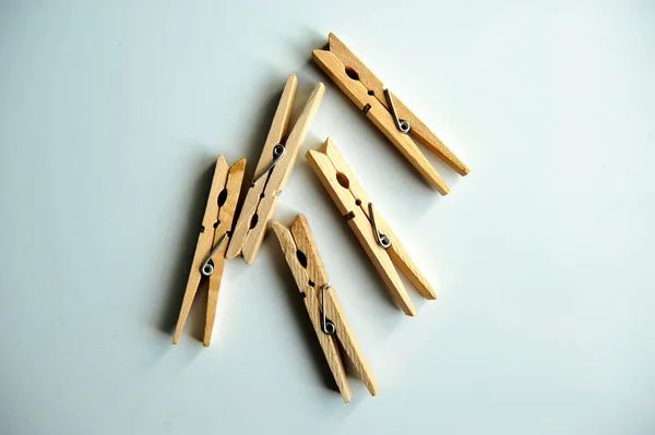 Wooden clothespins on the white background — Stock Photo, Image