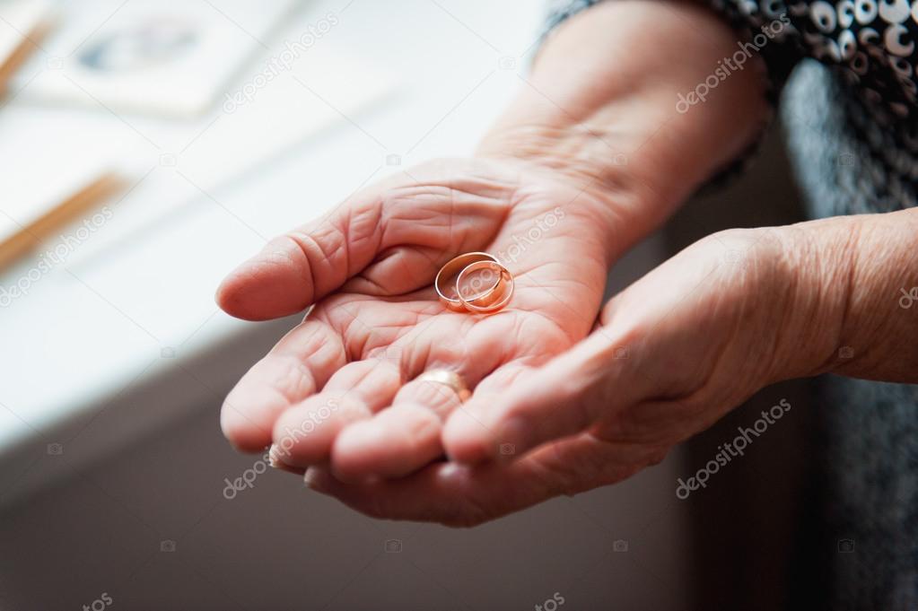 Hand 86th-years old Ukrainian women holding ring