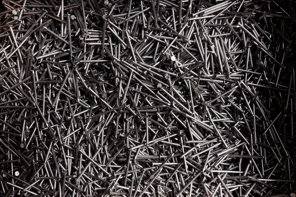 full frame background showing lots of metallic nails