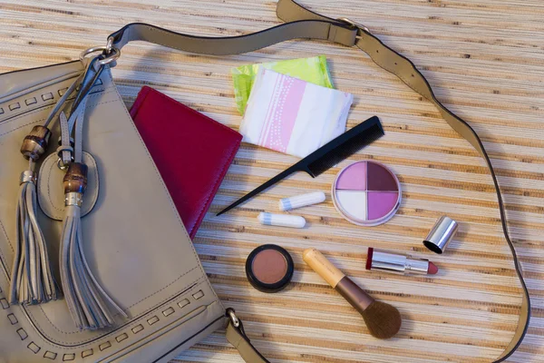 Open leather bag with women cosmetics — Stock Photo, Image