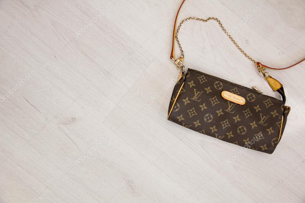 Download Louis Vuitton Monogram Pattern In Brown And Gold