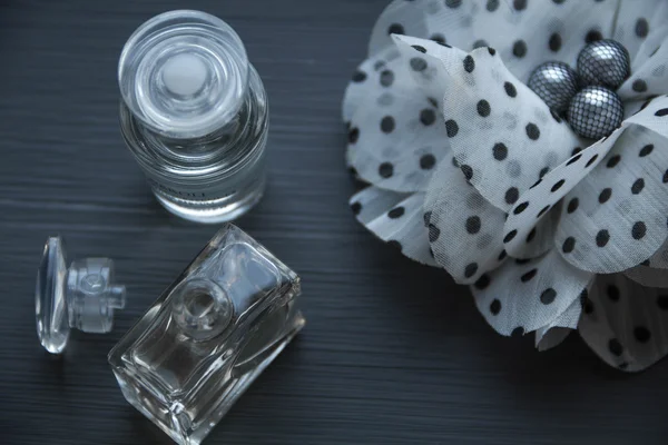 Perfume on wood black background — Stock Photo, Image